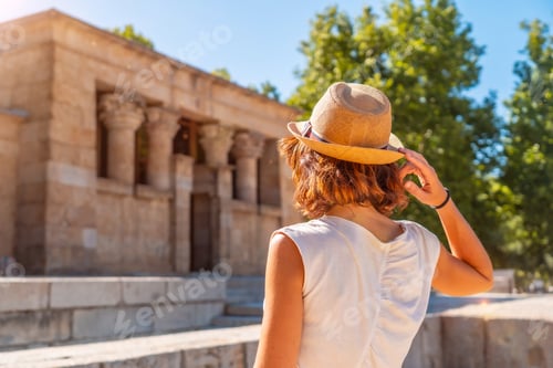 Preview: Temple of Debod in the city of Madrid of Egypt, young tourist woman with hat in the sunset