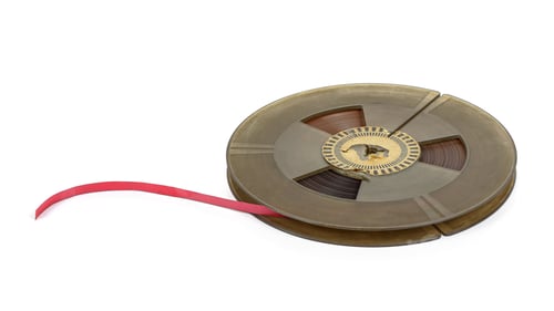 Preview: Reel of vintage audio tape on white background