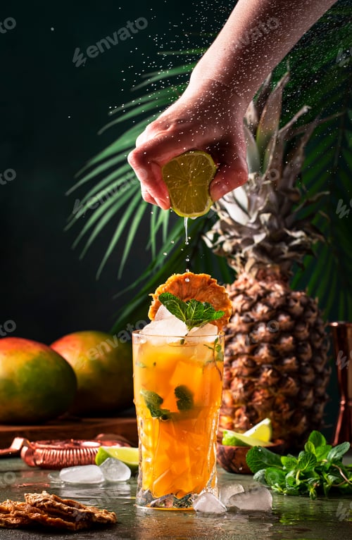 Preview: Summer cocktail with vodka, pineapple juice, mango, ice. Long drink or cold mocktail.
