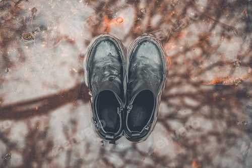 Preview: Boots over puddle top view