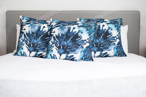 Preview: Blue cushions on bed