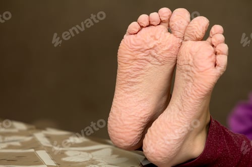 Preview: Close-up of children wrinkled feet after long bath