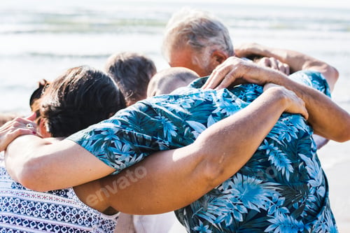 Preview: Senior friends playing at the beach