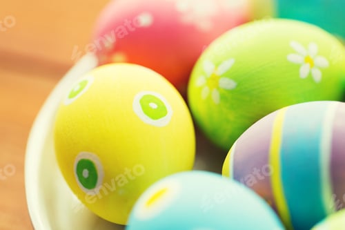 Preview: close up of colored easter eggs on plate