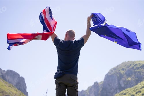 Preview: UK England Flag and European Union EU Flag holded by a man.