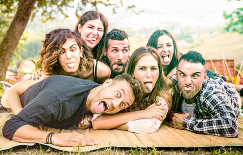 Preview: Millenial friends taking selfie with funny faces at pic nic barbecue