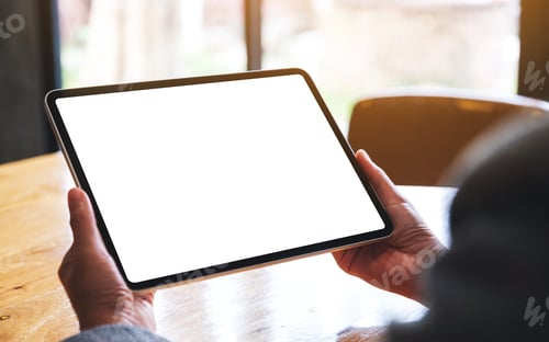 Preview: Mockup image of a woman holding digital tablet with blank white desktop screen