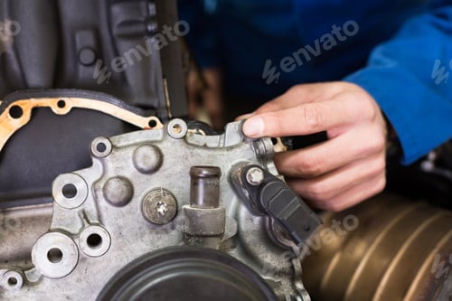 Preview: Mechanic working on an engine at the repair garage