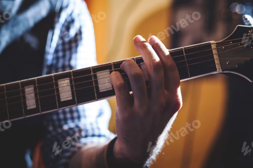 Preview: Playing classic guitar. Selective focus.