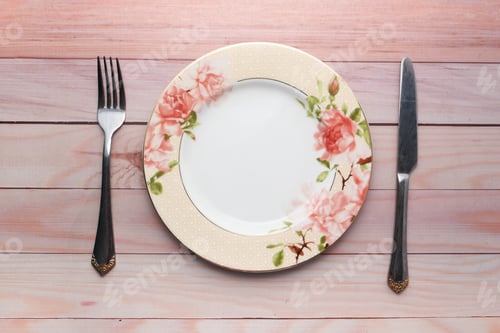 Preview: Clean plate and cutlery on wooden background