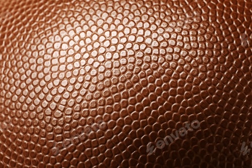 Preview: Leather American football ball as background, closeup