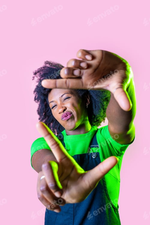 Preview: Young black woman making frame fingers isolated background