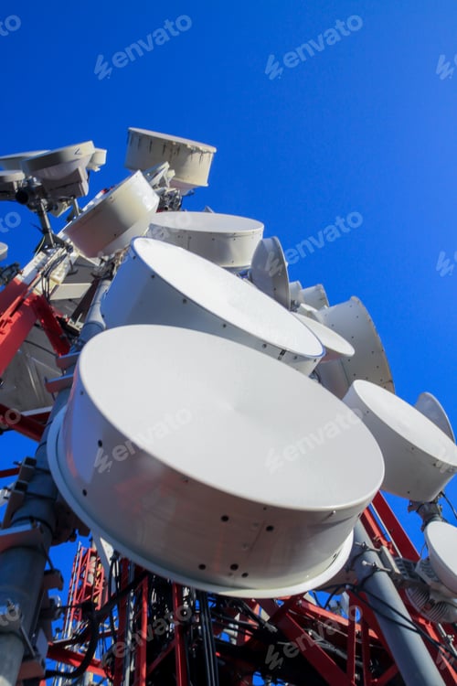 Preview: Vertical shot of a microwave antenna with the skies in the background