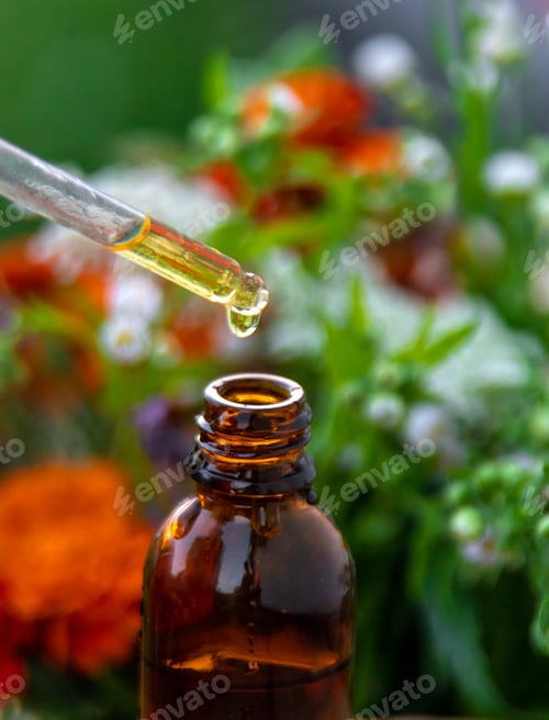 Preview: Essential oil of flowers and herbs drop. Selective focus.