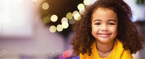 Preview: Portrait of cute little african girl over christmas tree