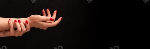 Preview: Woman's Hands Displaying Red Nail Polish Against Black