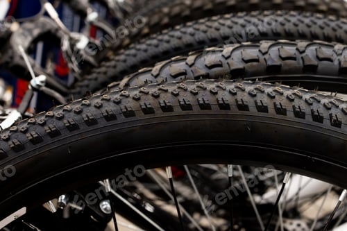 Preview: store has a new assortment of bicycle tires in storage, a stack of black tires.