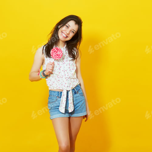 Preview: Happy young woman with lollipop