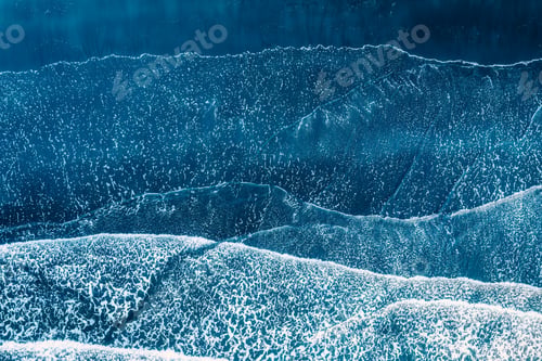 Preview: Sea wave crashing on the black sand beach