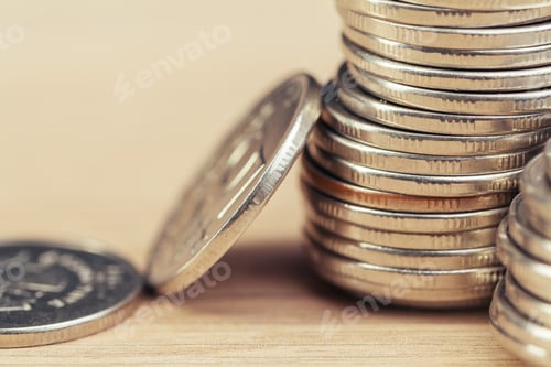 Preview: piles of coins on working table