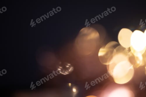 Preview: Blurred Christmas lights over dark blue background