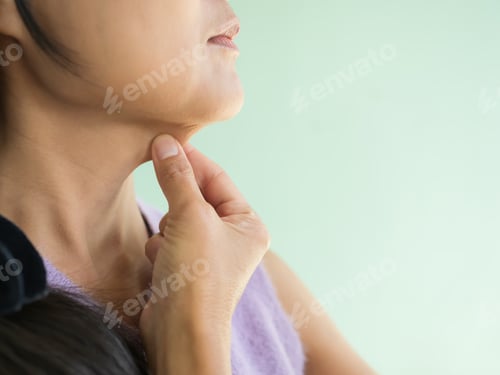 Preview: Women Pinching Layer Fat Under Chin on Green Wall Background