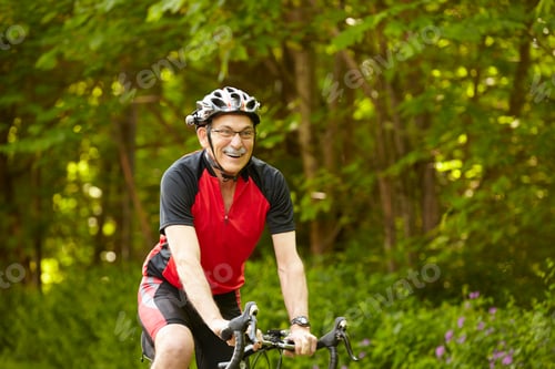 Man Cycling Through a Beautiful Forest