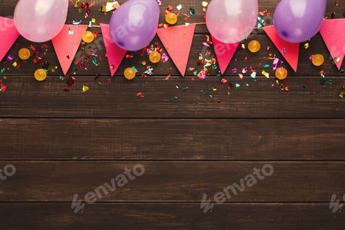 Preview: Colorful flags garland on wooden background