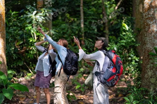 Preview: Backpack tourist travel outdoor adventure bird study using binoculars looking and record to book