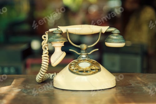 Preview: Connection technology concept. Old telephone on wood table.