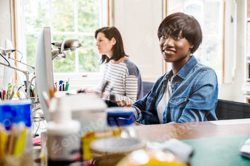 Preview: Female designers at desktop computers in creative studio