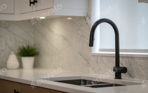 Preview: Closeup shot of a black faucet with a shite sink in a kitchen