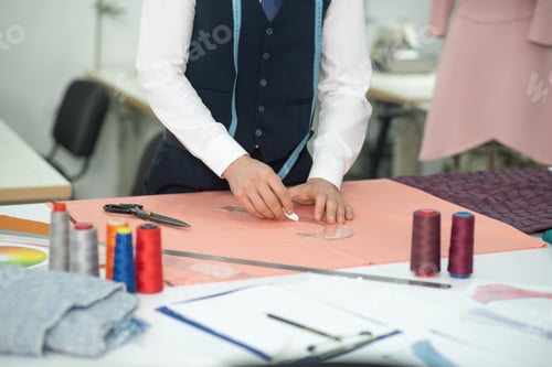 Preview: Tailor at Work Tracing a Pattern with Chalk