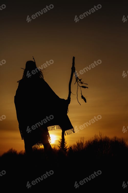 Preview: silhouette of native american shaman with pikestaff