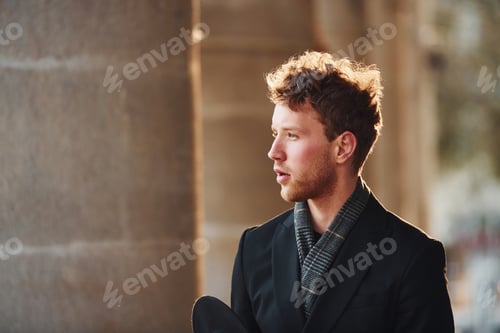 Preview: Portrait of elegant young man in formal classy clothes that outdoors in the city