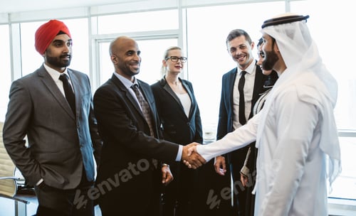 Preview: Mixed business team making agreements on future business plans. in the office