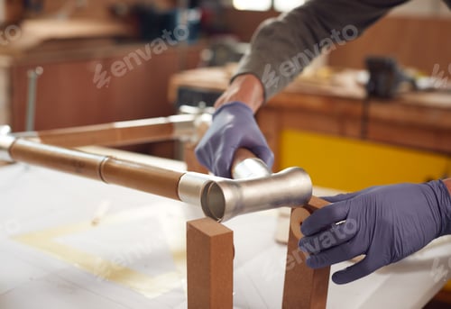 Preview: Close Up Of Male Craftsman In Workshop Assembling Hand Built Sustainable Bamboo Bicycle Frame