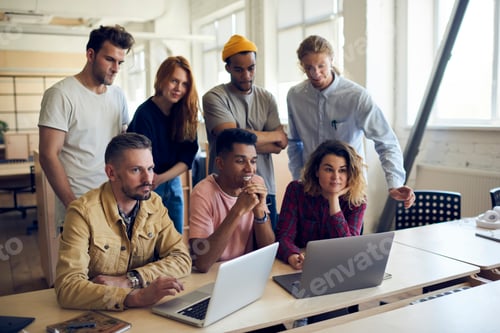 Preview: Successful colleagues enjoying brainstorming meeting in coworking