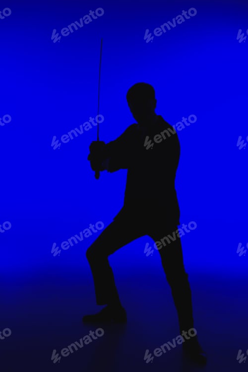Preview: toned picture of silhouette of agent in suit with Katana