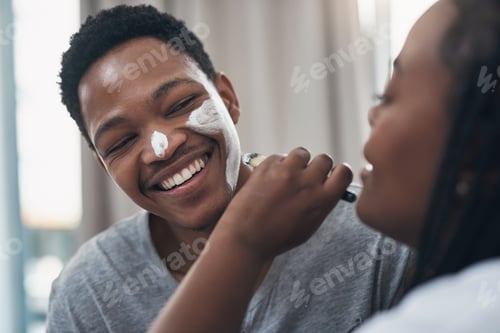 Preview: More glow, less gender roles. Shot of a young couple getting homemade facials together at home.