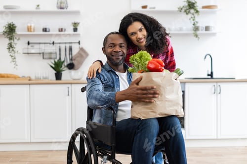 Preview: Couple with Groceries in Kitchen