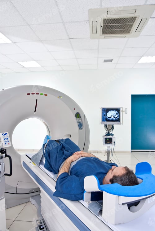 Man Preparing for a Medical CT Scan Procedure