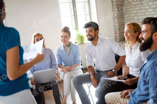 Preview: Successful happy group of people learning software engineering and business during presentation
