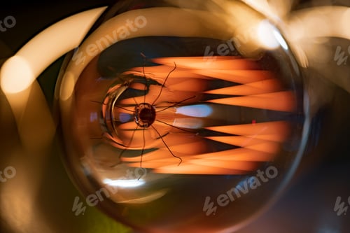 Preview: An incandescent lamp illuminates a dark room with orange light