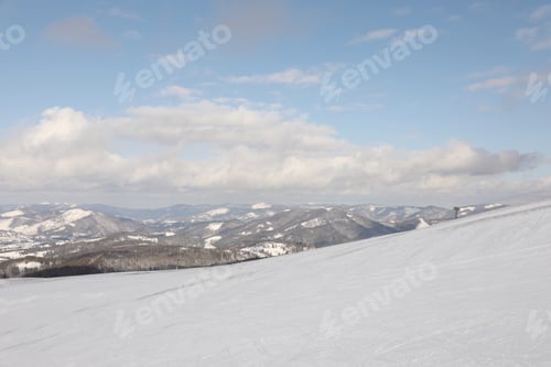 Preview: Picturesque mountain landscape with snowy hills in winter