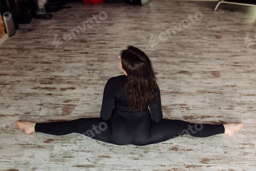 Preview: Young woman practicing yoga and fly yoga concept