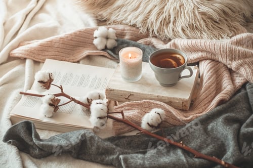 Preview: Sweaters and cup of tea with autumn decor on the books. Read, Rest.