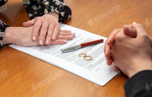 Preview: Divorce signature, marriage dissolution document. Wedding ring and agreement on lawyer office table