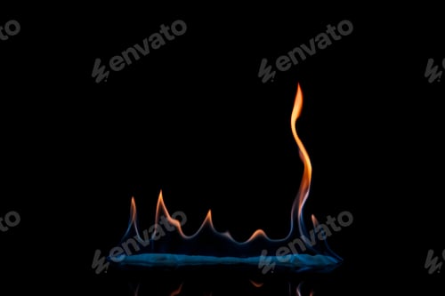 Preview: close up view of small burning orange and blue flame on black background