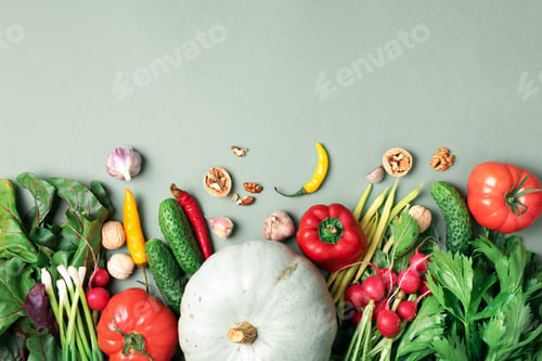 Preview: Vegan and vegetarian diet, harvest concept. Autumn vegetables on green background. Top view